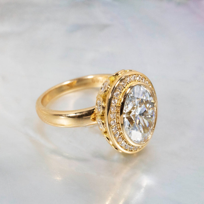 Oval Diamond Engagement Ring with Diamond Halo and Filigree Details Kris Averi 